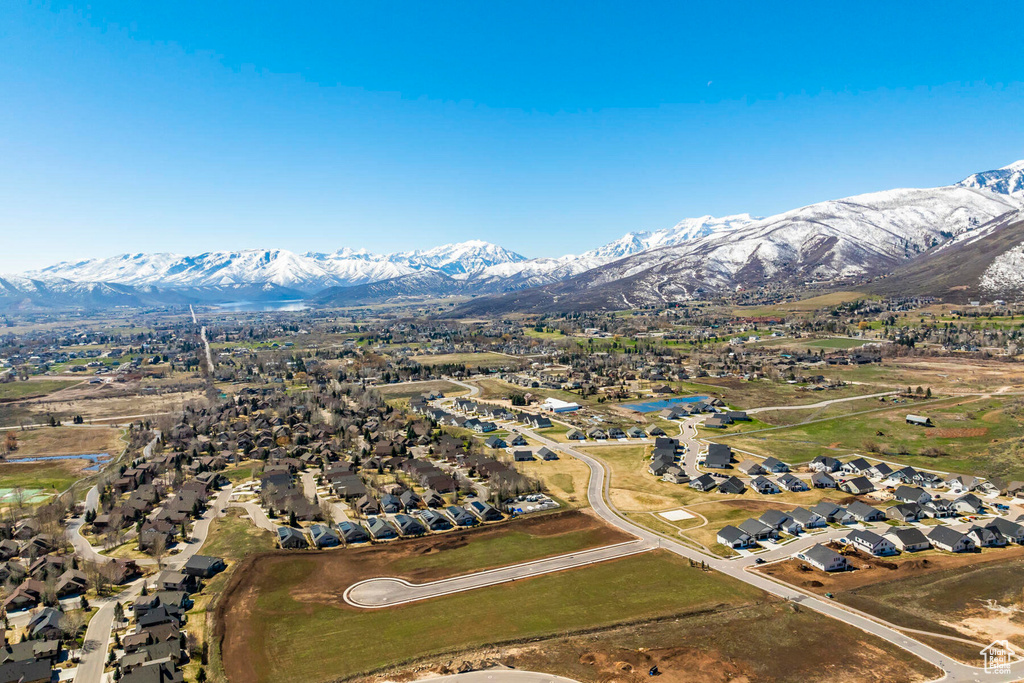 View of property location with a mountain backdrop and nearby suburban area
