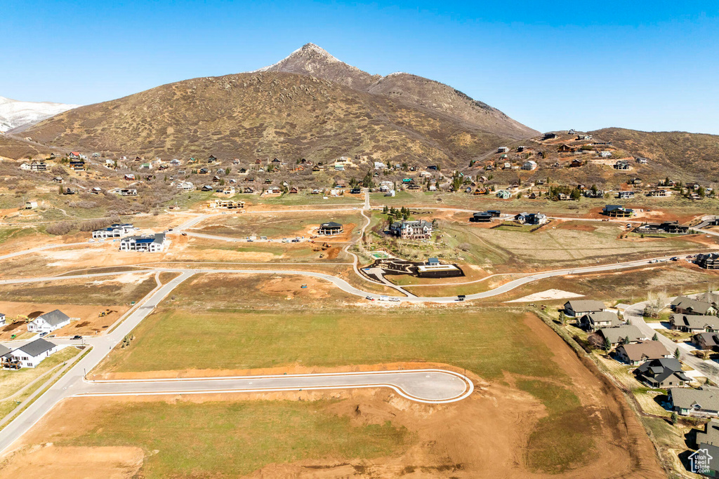Aerial view of property's location featuring mountains
