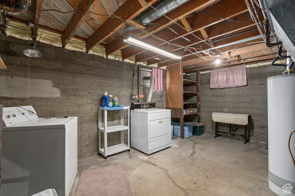 Basement with water heater and washing machine and clothes dryer