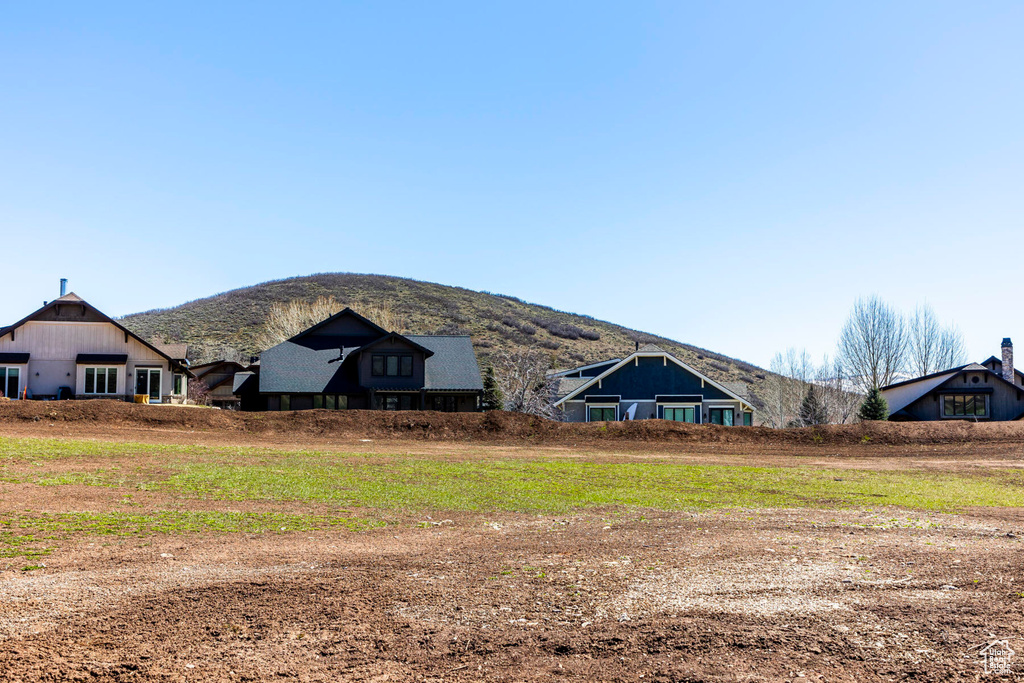 Rear view of house featuring a mountain view