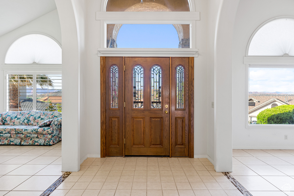 Entrance foyer featuring light tile floors