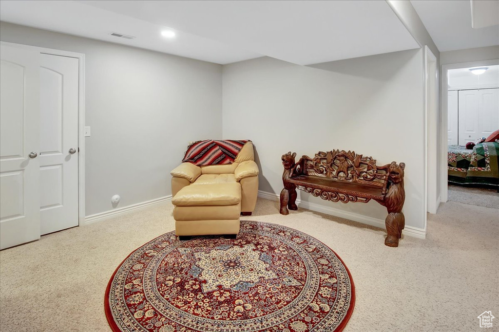 Sitting room with light colored carpet