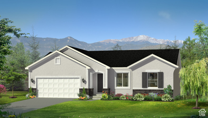 Ranch-style house featuring a mountain view, a garage, and a front lawn