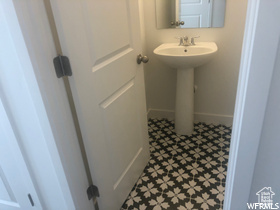 Bathroom with sink and tile floors