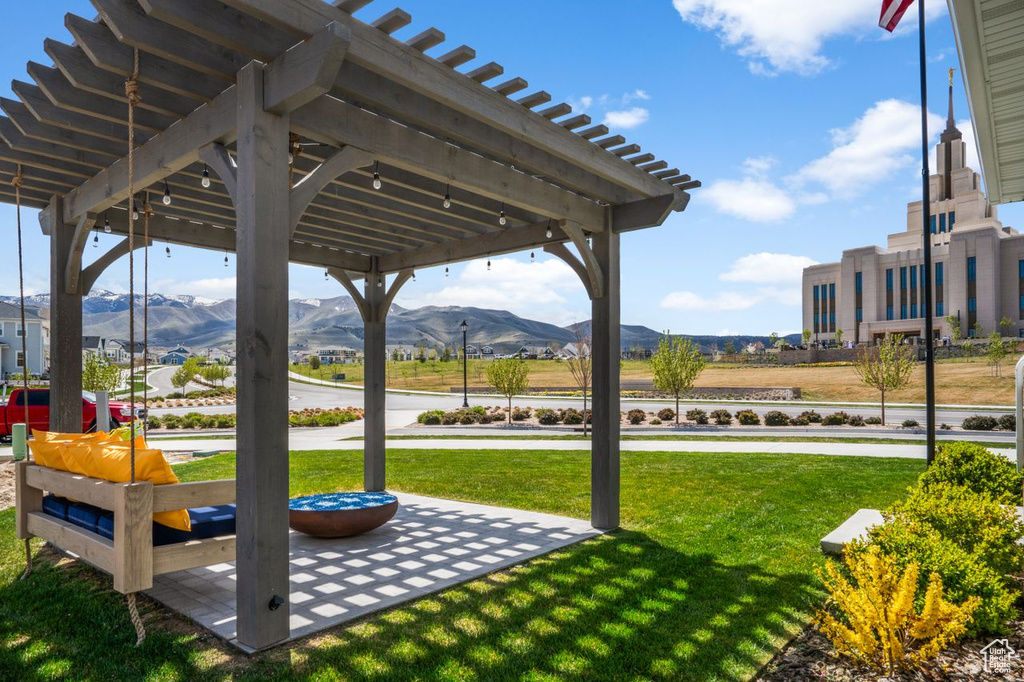 View of yard featuring a mountain view and a pergola