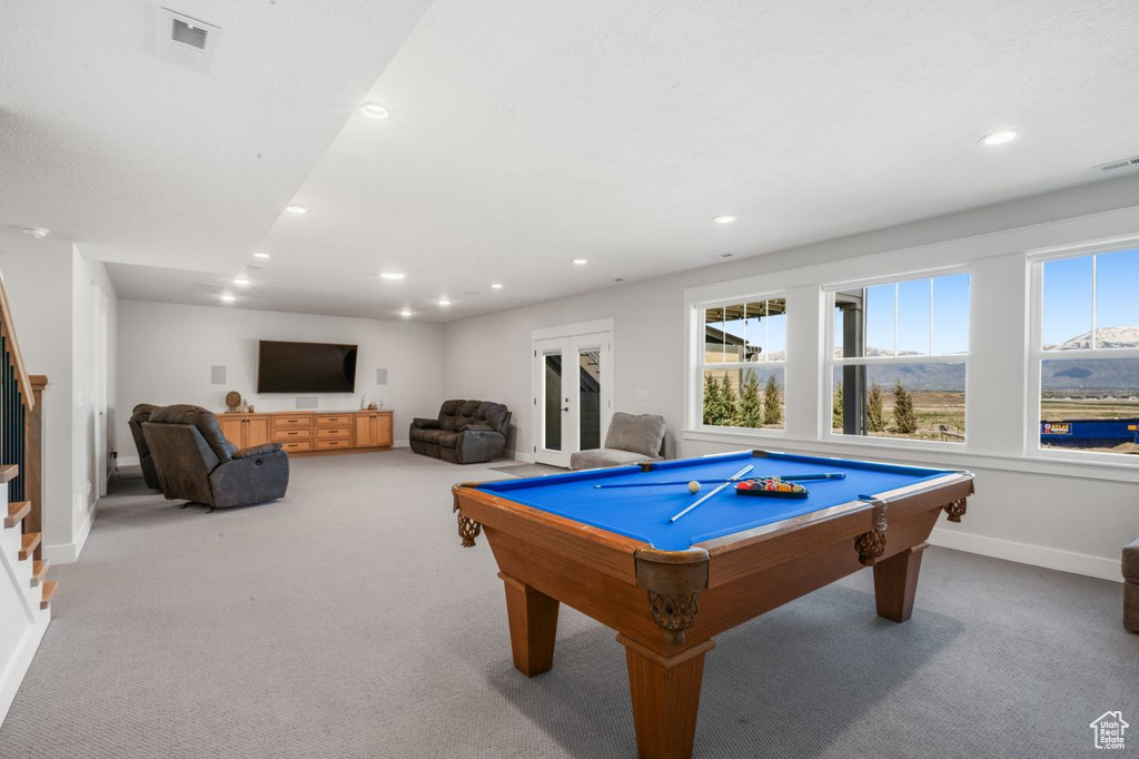 Playroom featuring plenty of natural light, carpet, and pool table
