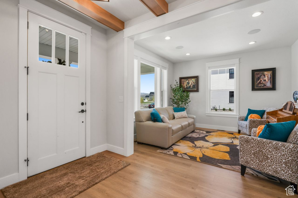 Entryway featuring beamed ceiling and light hardwood / wood-style floors