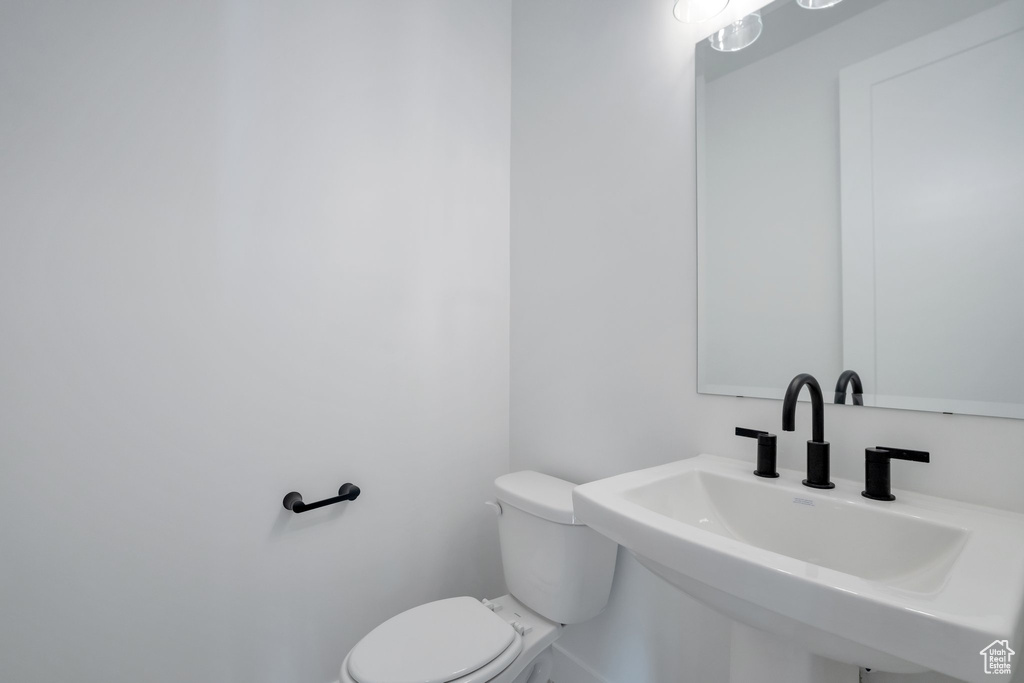 Bathroom with sink and toilet