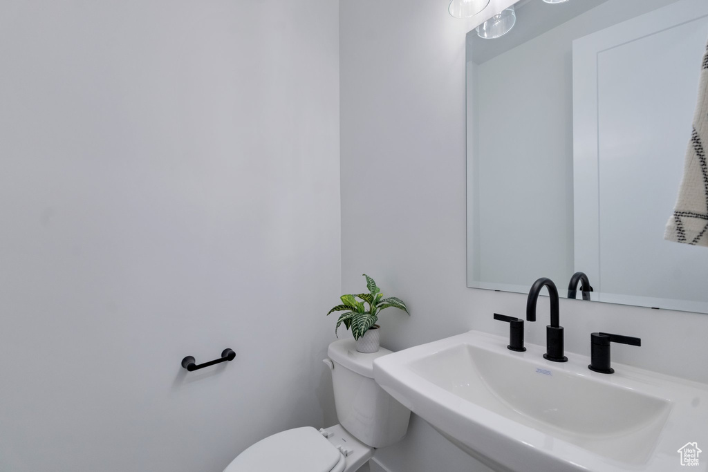 Bathroom with sink and toilet