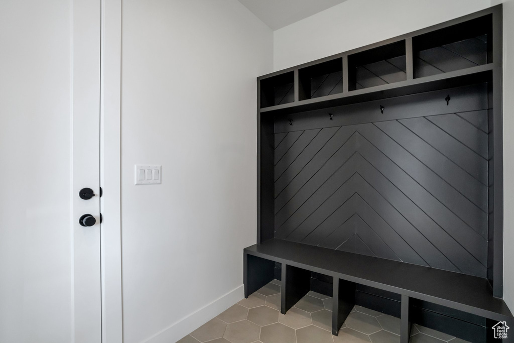 Mudroom with light tile flooring