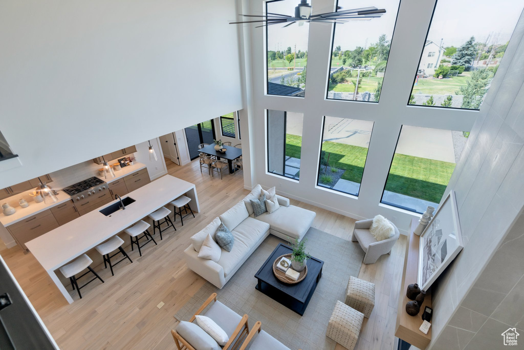 Living room featuring a high ceiling and a wealth of natural light