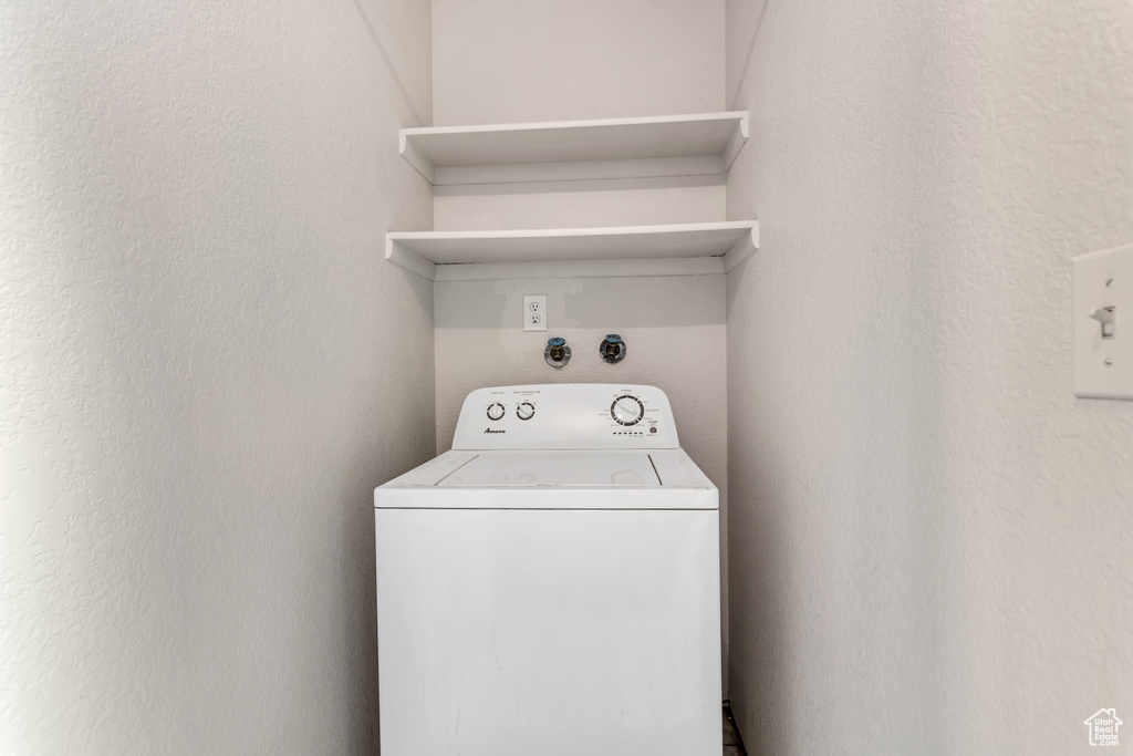 Laundry room featuring washer / clothes dryer
