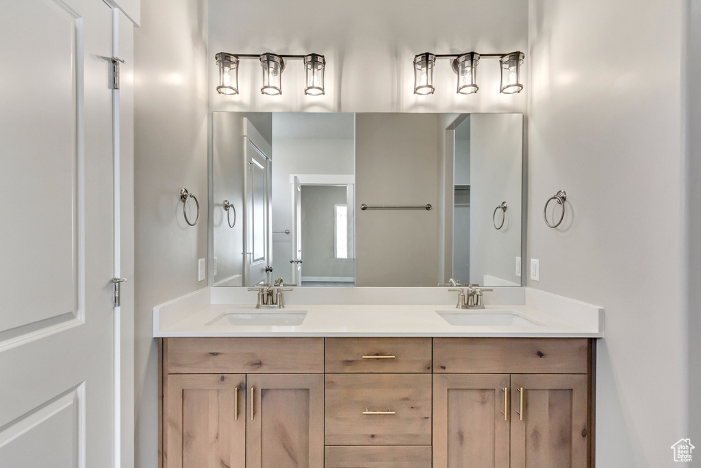 Bathroom with large vanity and dual sinks
