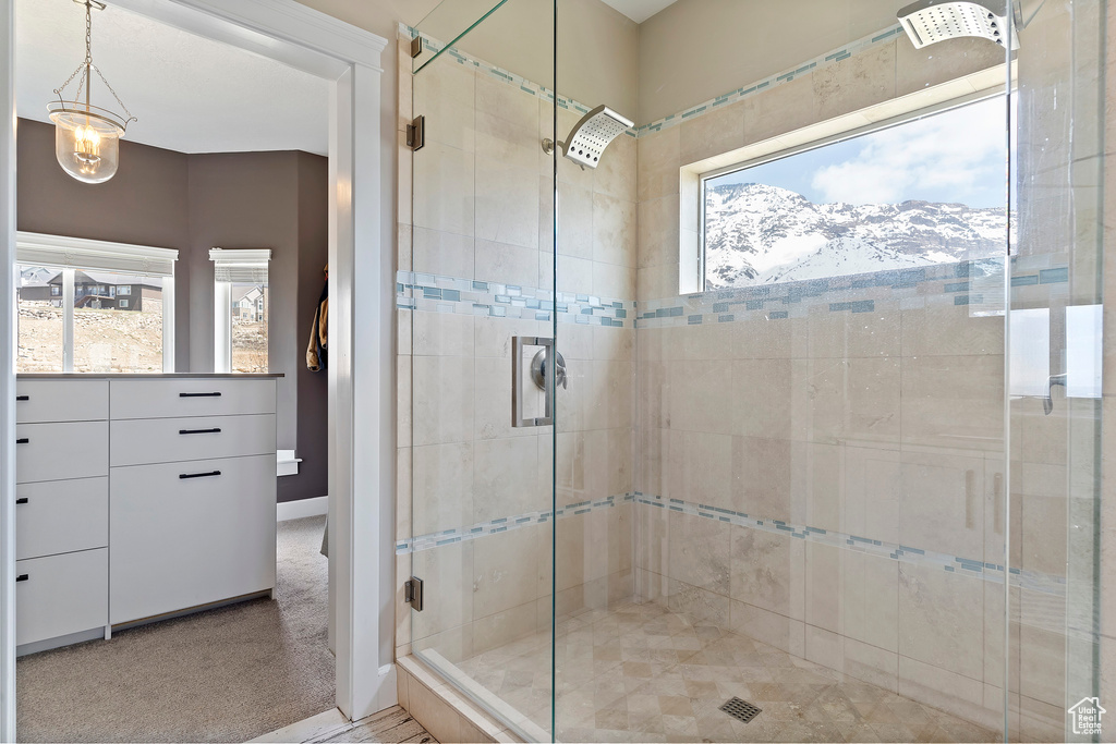 Bathroom with a mountain view and an enclosed shower