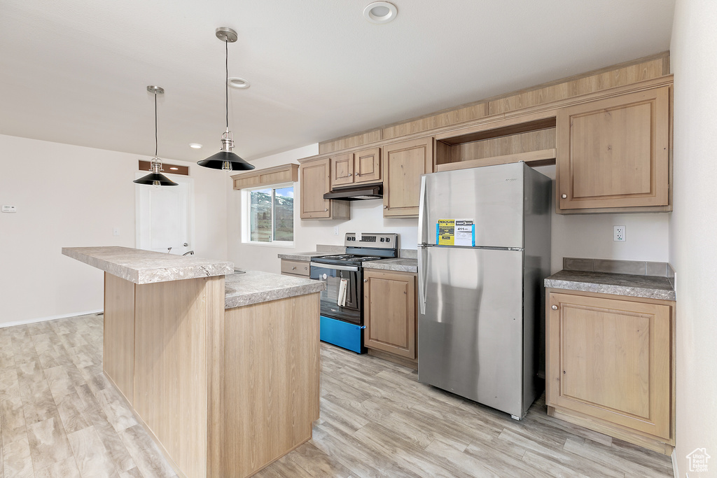 Kitchen featuring a kitchen island, light hardwood / wood-style flooring, pendant lighting, and stainless steel appliances