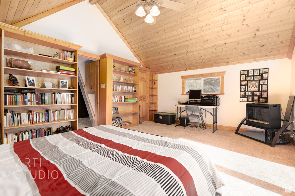 Bedroom with light carpet, vaulted ceiling, and wood ceiling