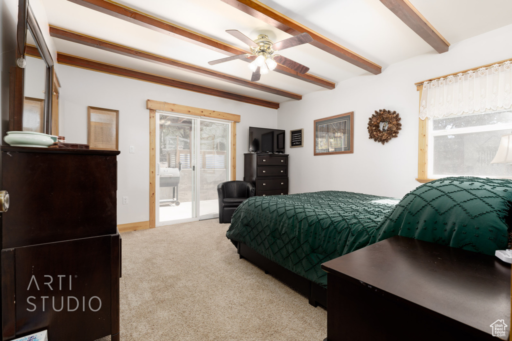 Bedroom featuring light colored carpet, beam ceiling, ceiling fan, and access to exterior