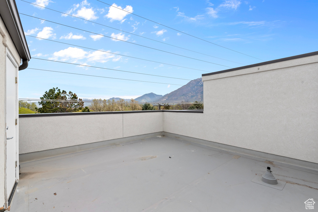 View of patio / terrace featuring a mountain view and a balcony