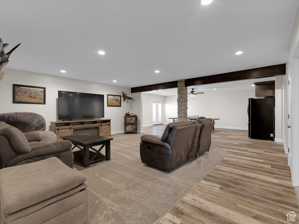 Living room featuring light hardwood / wood-style floors and brick wall