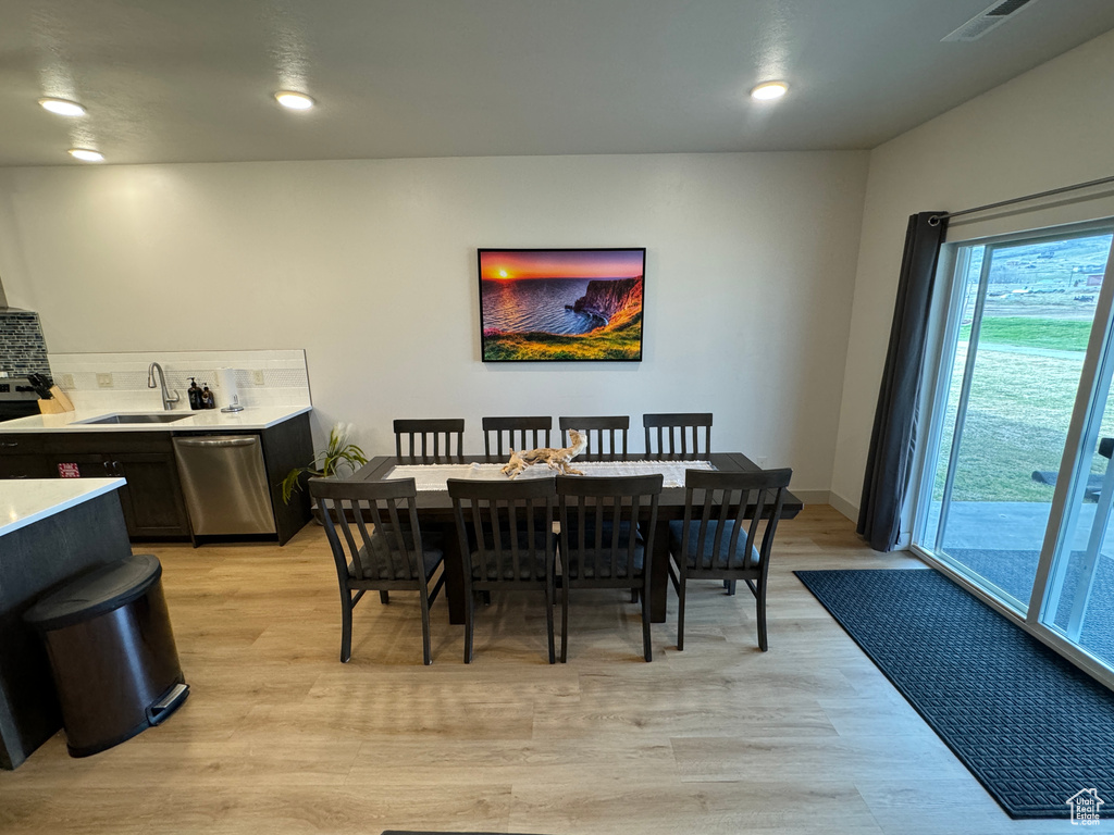 Dining room featuring light hardwood / wood-style flooring and sink