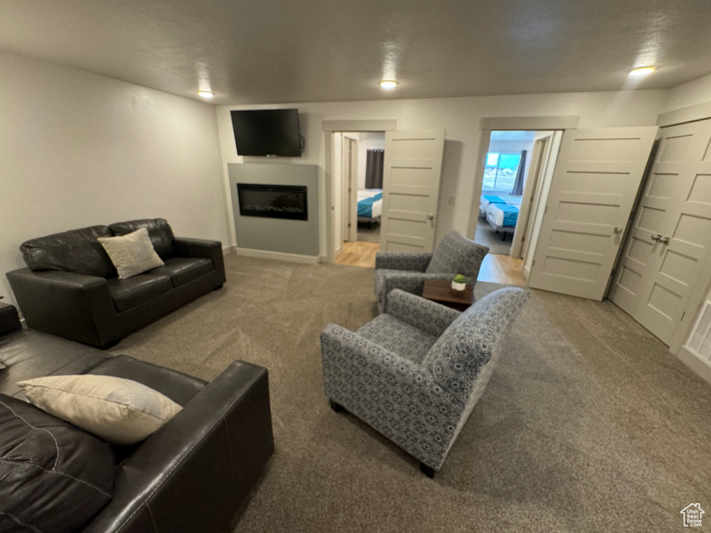 Living room featuring light colored carpet