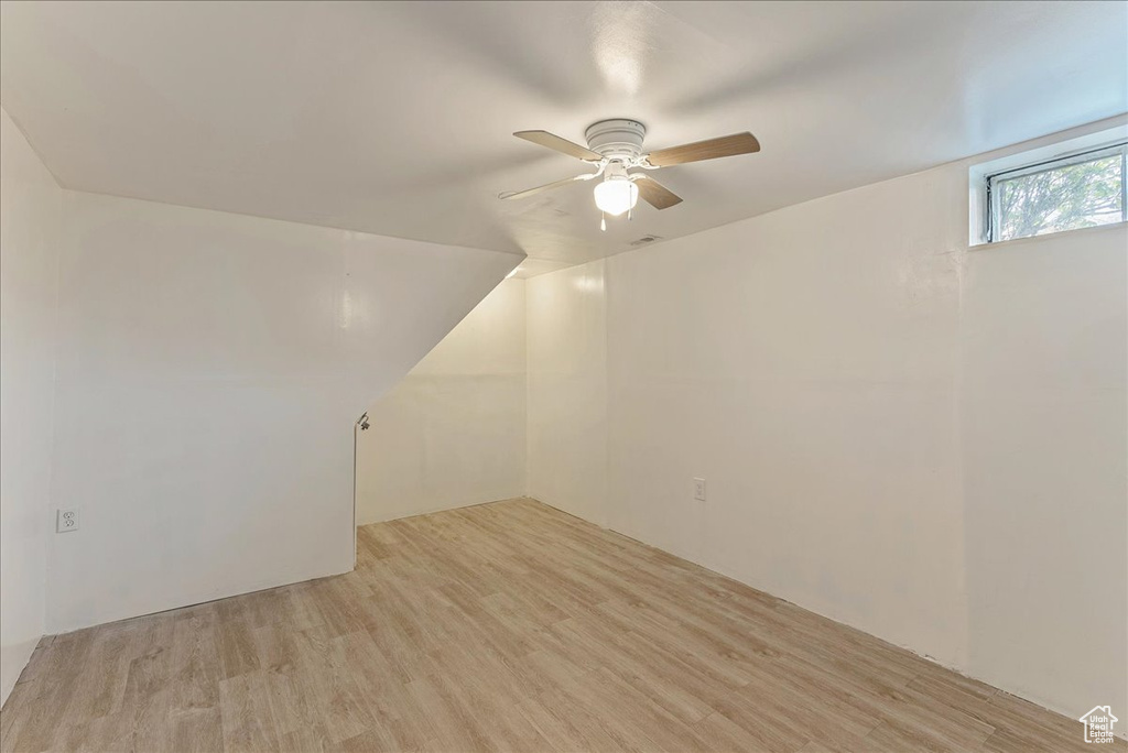 Unfurnished room featuring light hardwood / wood-style flooring and ceiling fan