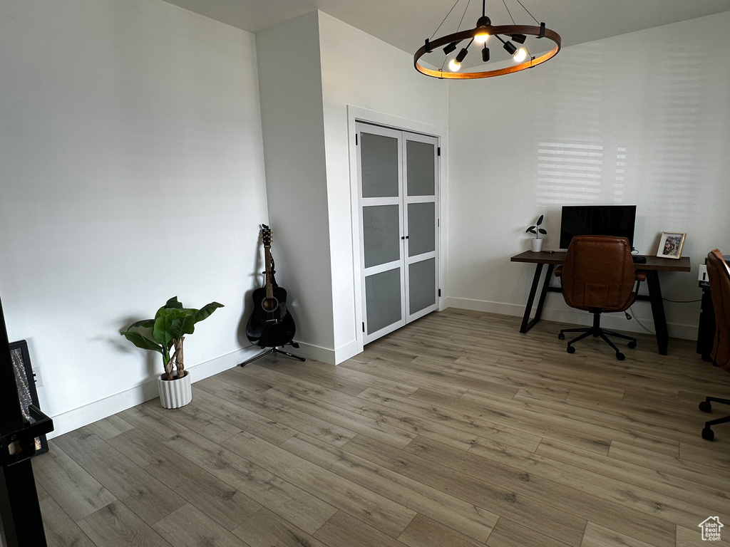 Home office with wood-type flooring