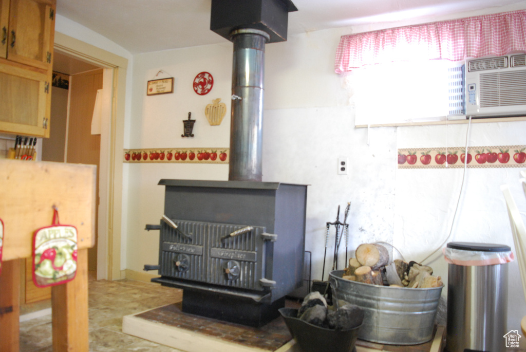 Interior details with a wood stove and tile flooring