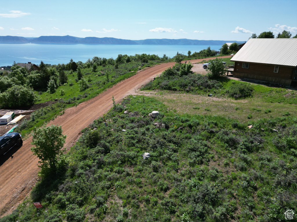 Drone / aerial view with a water and mountain view