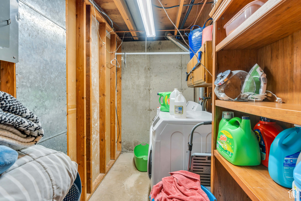 Storage room featuring washer / dryer