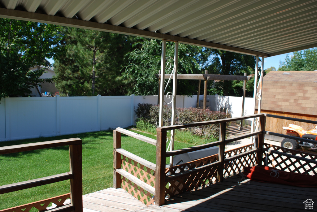 Deck featuring a yard