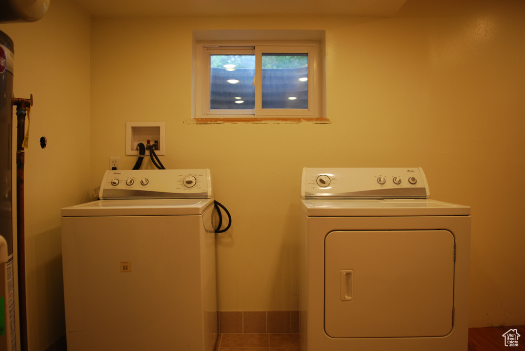 Washroom featuring independent washer and dryer, tile floors, and hookup for a washing machine