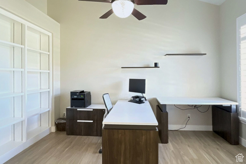 Office area with ceiling fan and light wood-type flooring