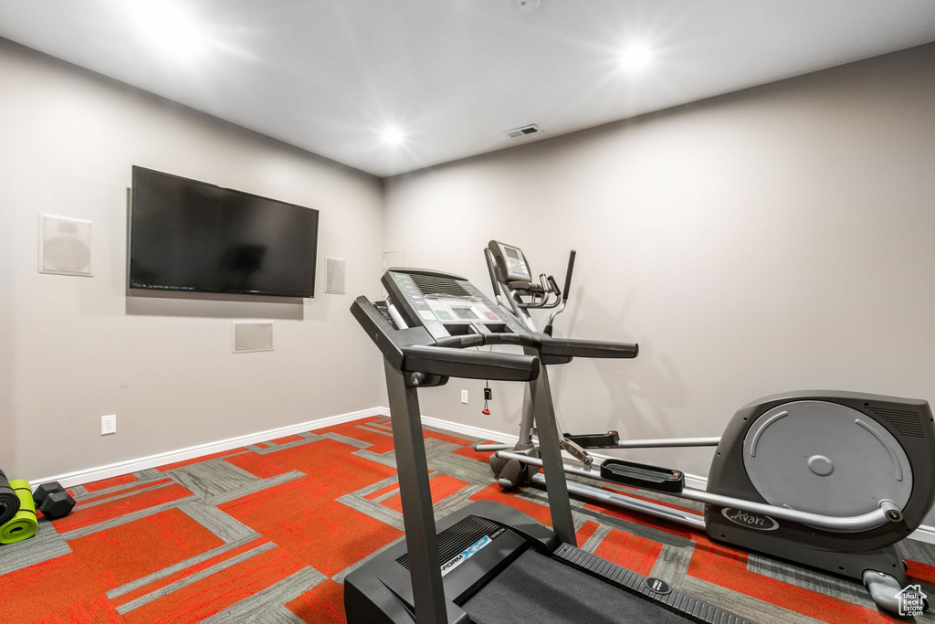 Workout room featuring carpet