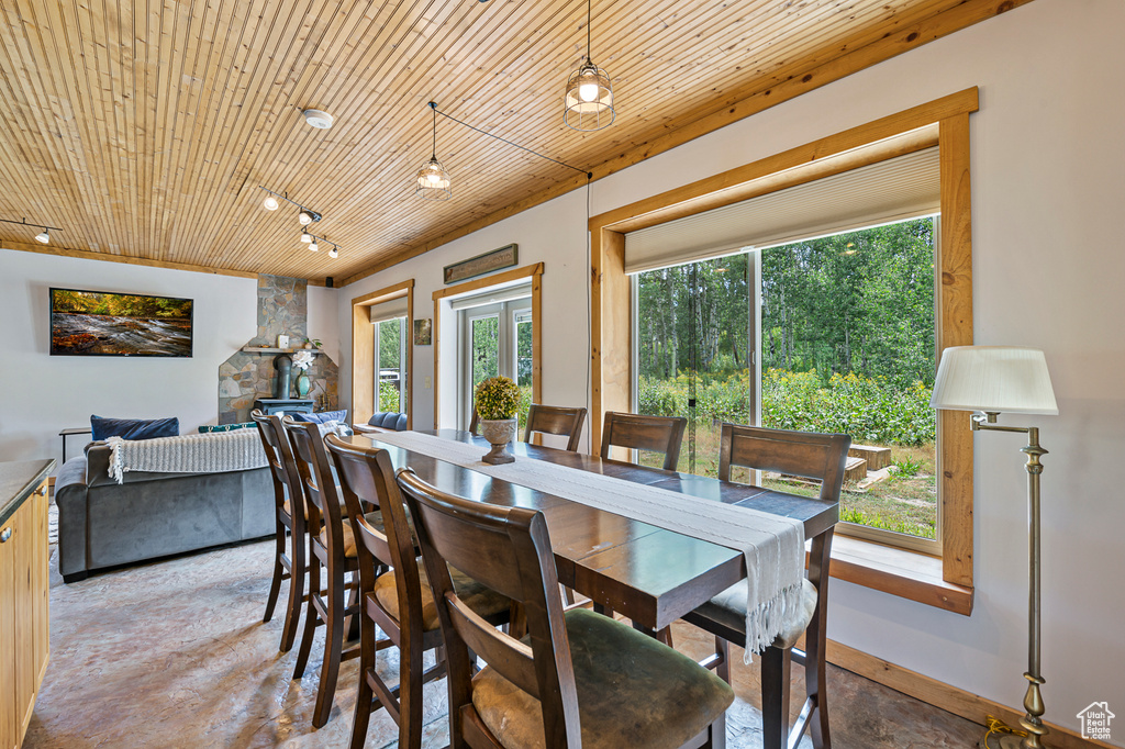 Dining area with wood ceiling and a wealth of natural light