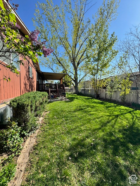 View of yard featuring a wooden deck