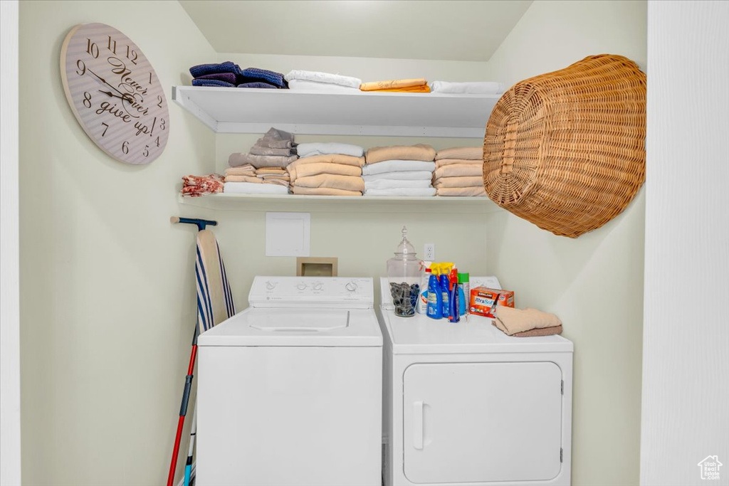 Laundry room with washer hookup and washing machine and clothes dryer