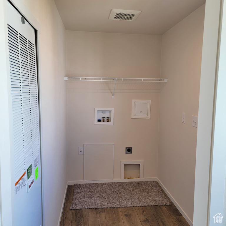 Laundry area with washer hookup, dark wood-type flooring, and electric dryer hookup