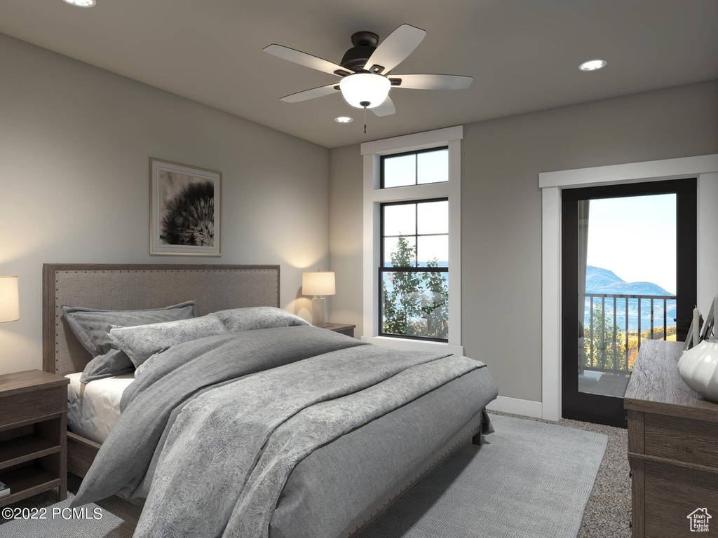 Carpeted bedroom with ceiling fan, access to exterior, and multiple windows