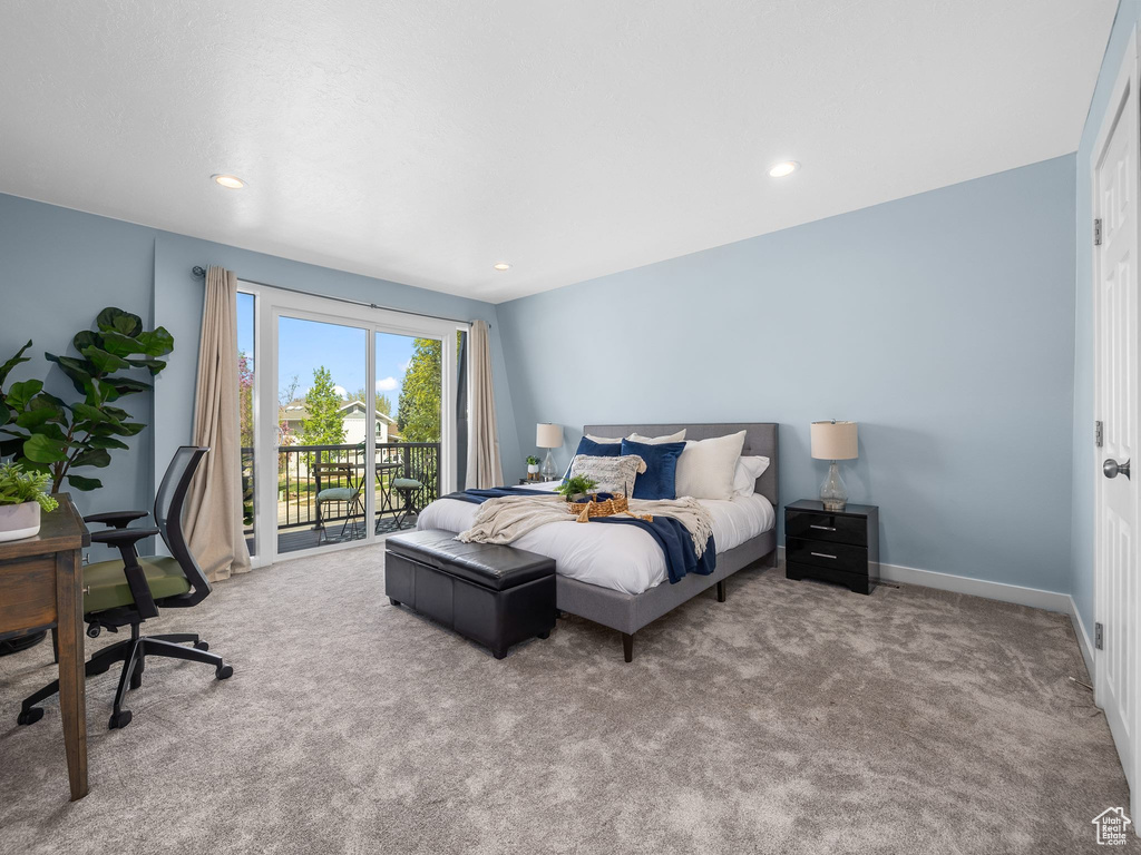 Carpeted bedroom featuring access to exterior