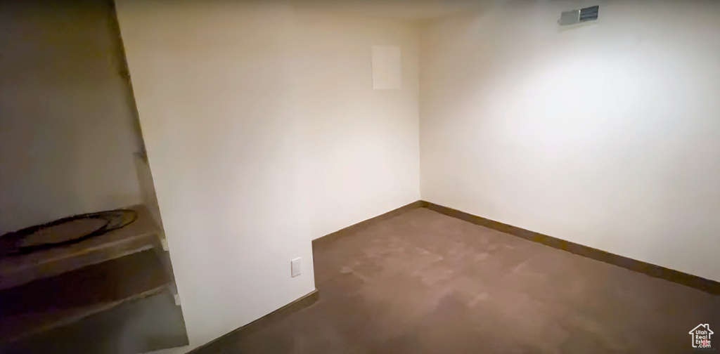 Unfurnished room featuring concrete floors