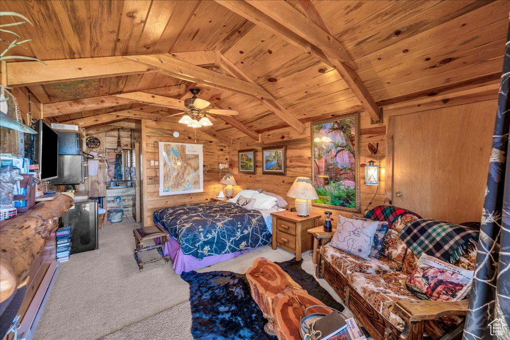 Carpeted bedroom featuring lofted ceiling with beams, wood walls, and wood ceiling