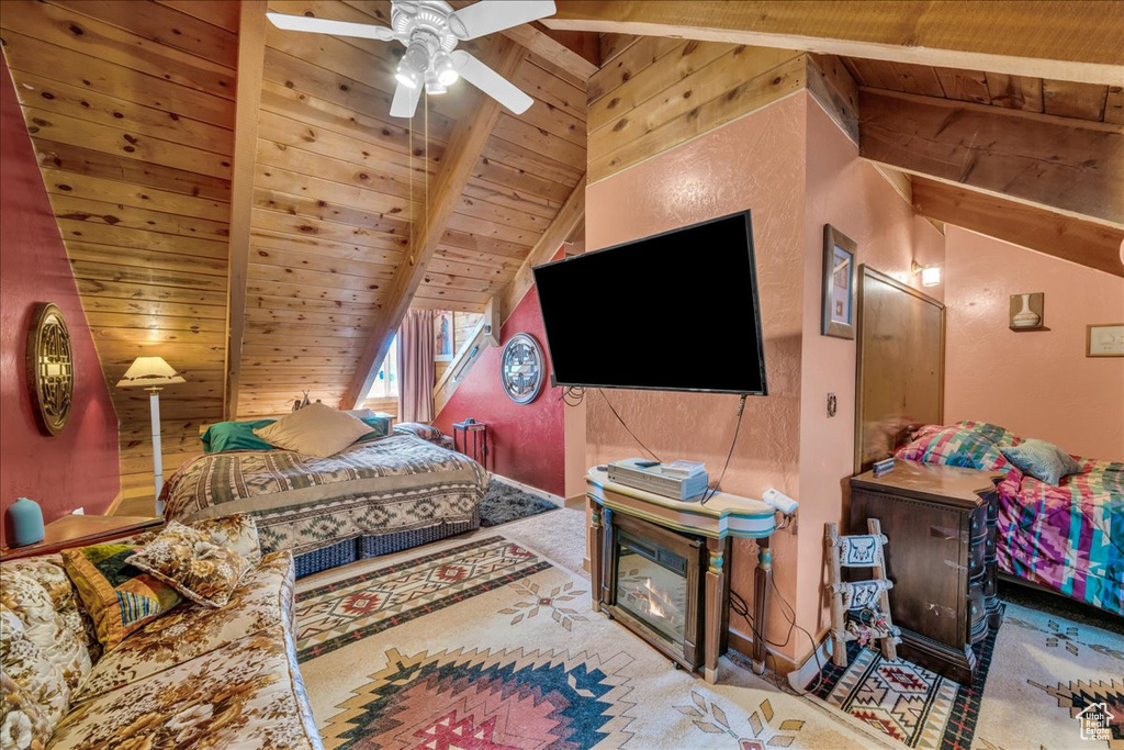 Carpeted bedroom with wood ceiling, ceiling fan, and vaulted ceiling with beams