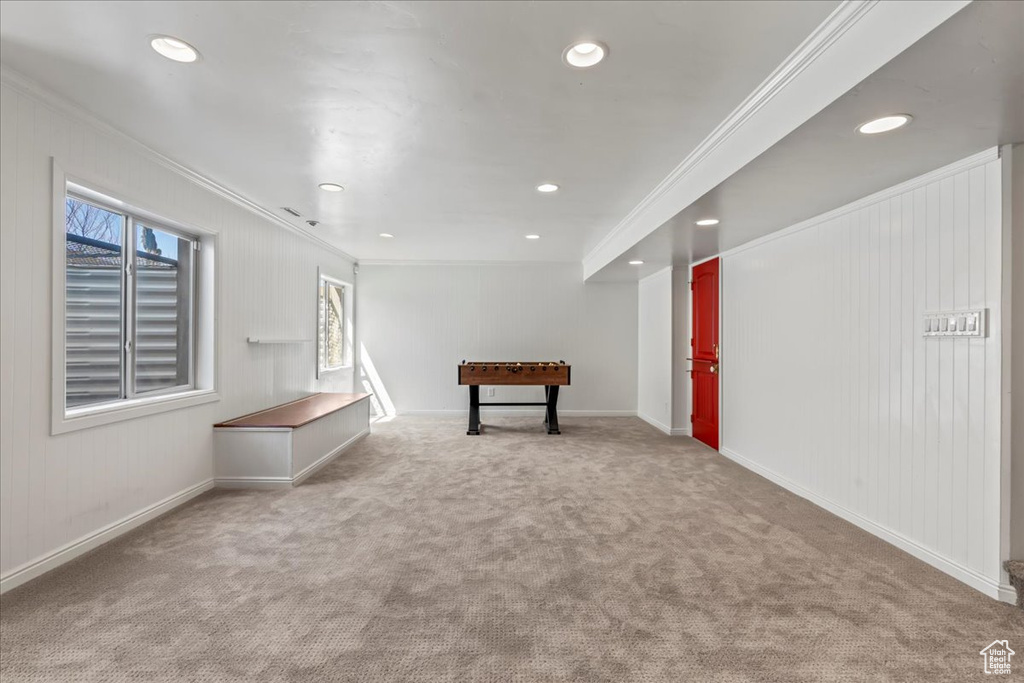 Interior space with ornamental molding and carpet floors