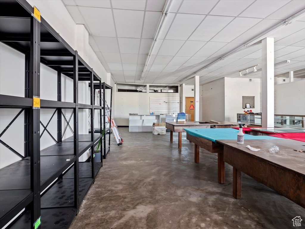 Game room with concrete flooring and billiards