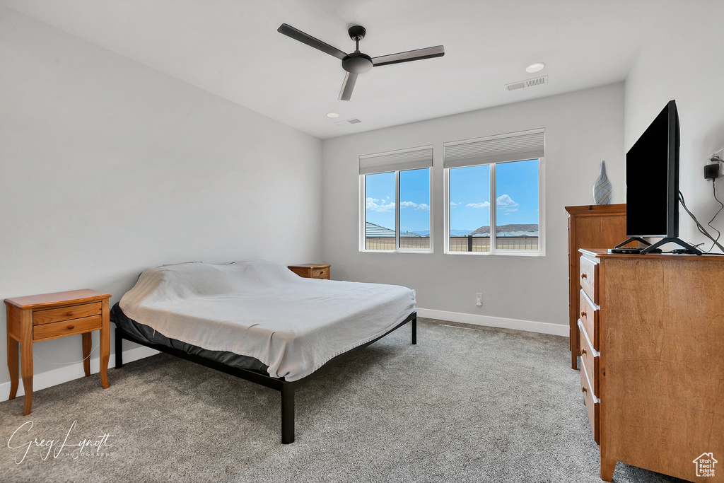 Bedroom featuring carpet and ceiling fan