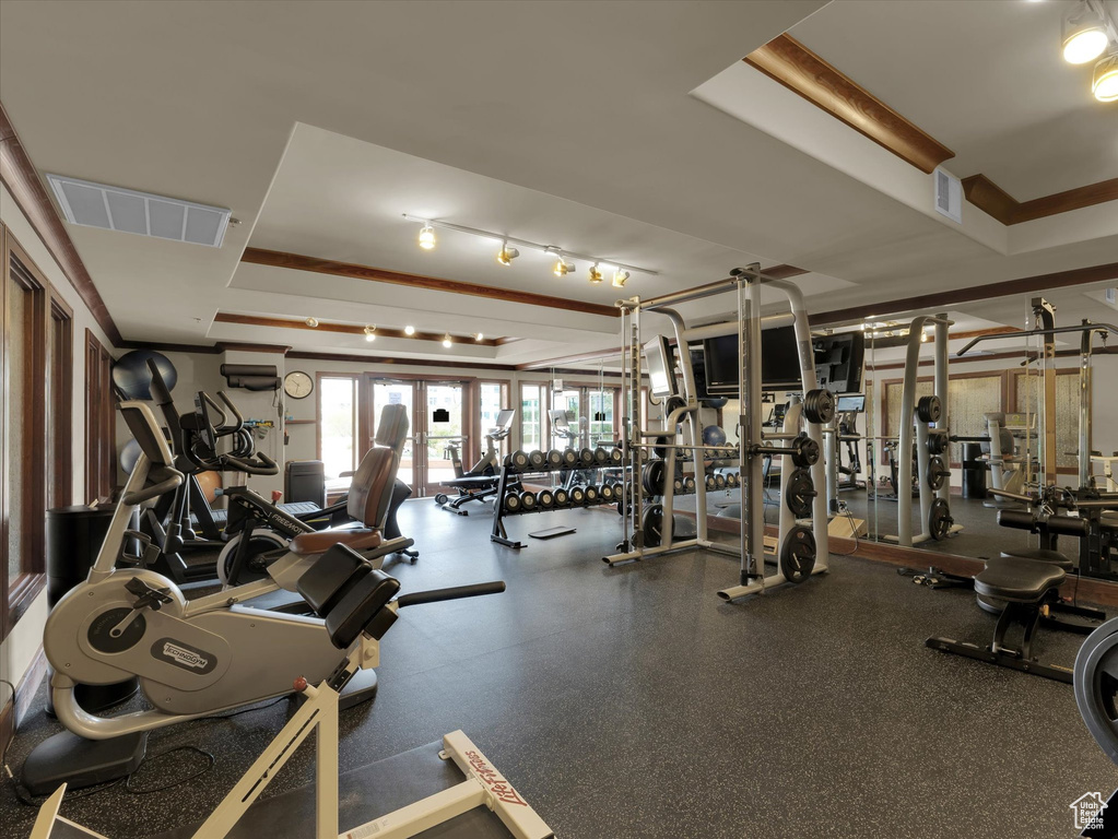 Gym with a raised ceiling and track lighting