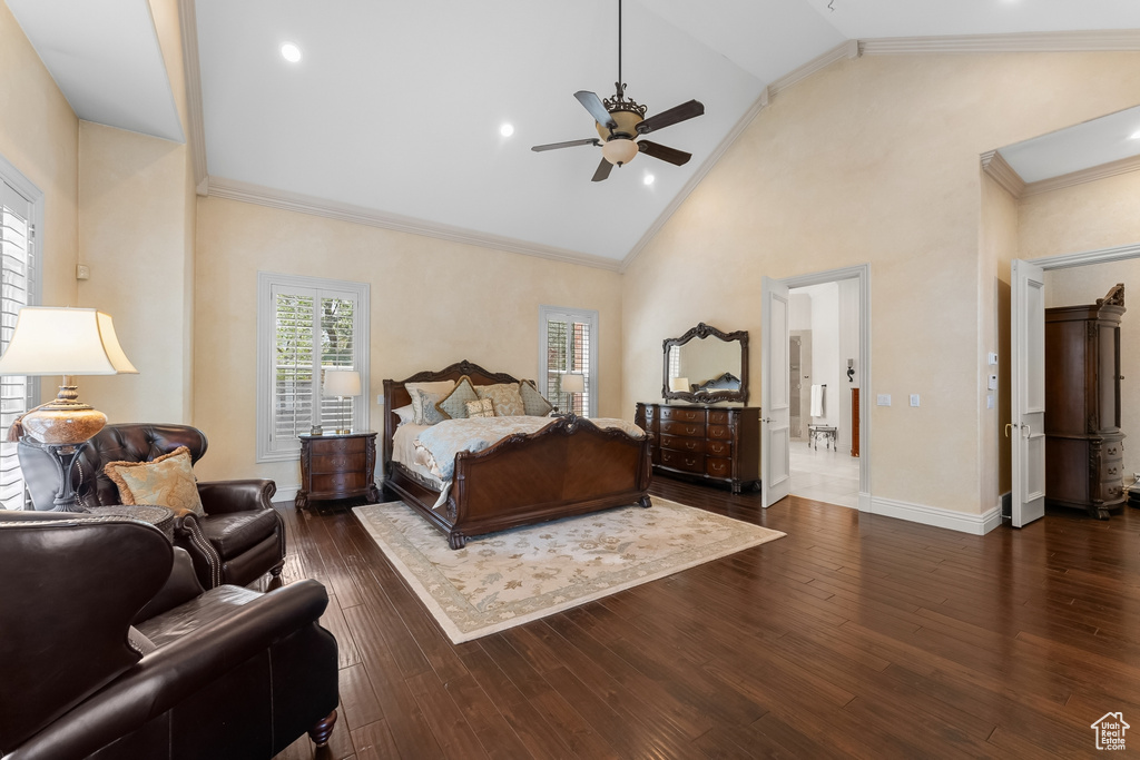 Bedroom with dark tile floors, crown molding, high vaulted ceiling, and ceiling fan