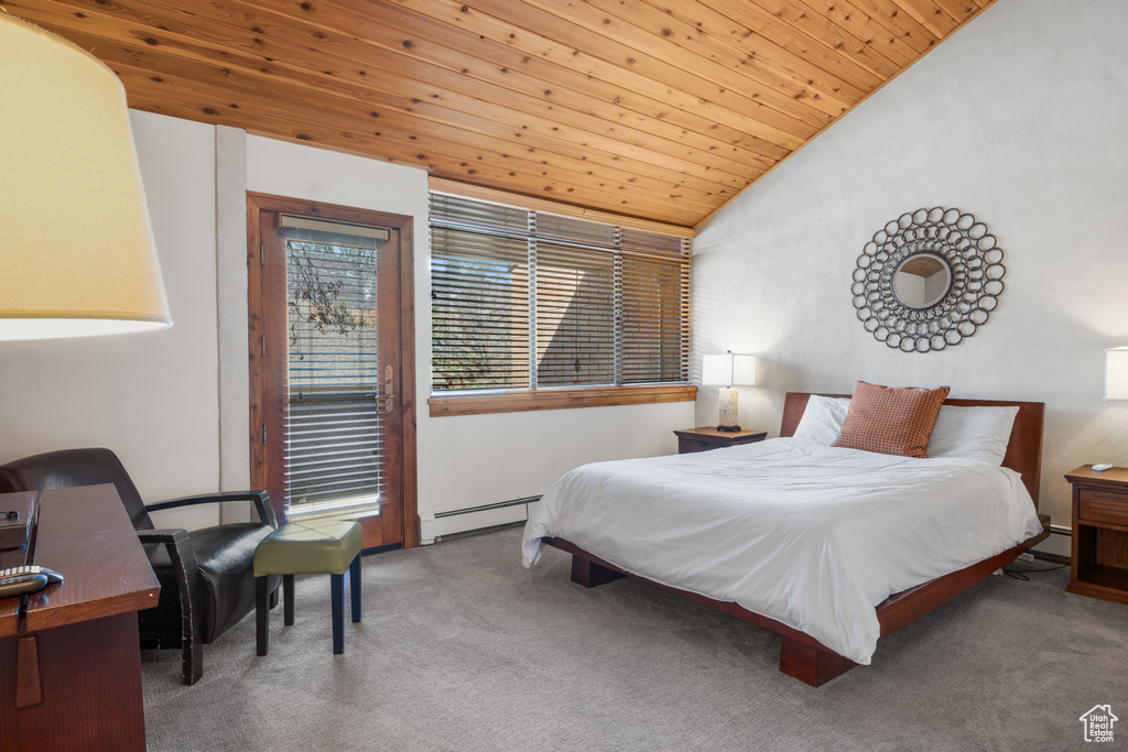Bedroom featuring wood ceiling, lofted ceiling, carpet, and a baseboard heating unit