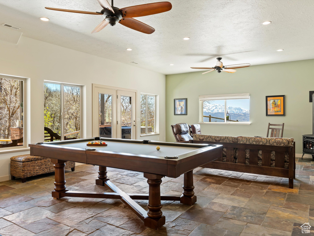 Rec room with a healthy amount of sunlight, tile floors, and billiards